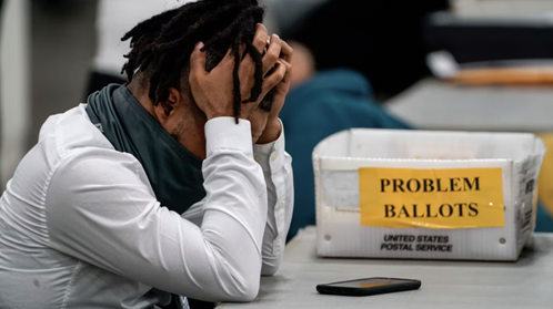 An election worker at the TCF Center.Kent Nishimura / Los Angeles Times via Getty Images file